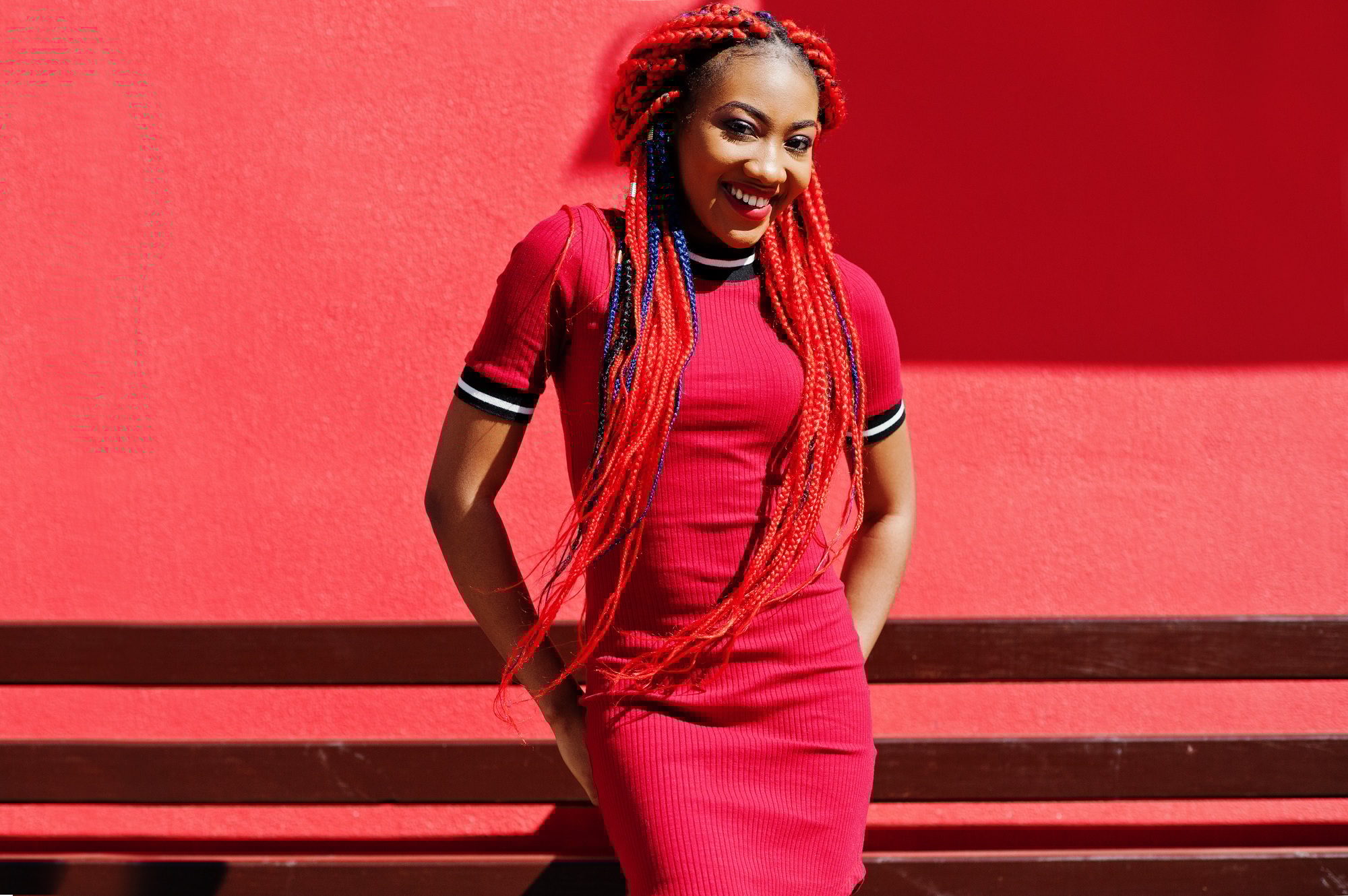 African american girl in red dress with dreadlocks